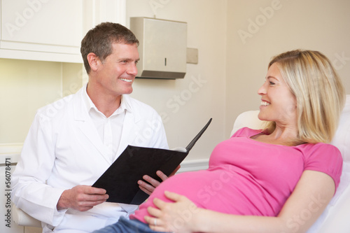 Pregnant Woman Being Given Ante Natal Check By Doctor © Monkey Business