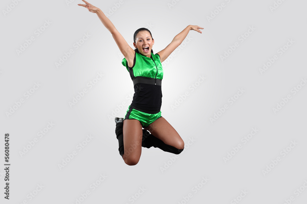 Young female dancer against white background