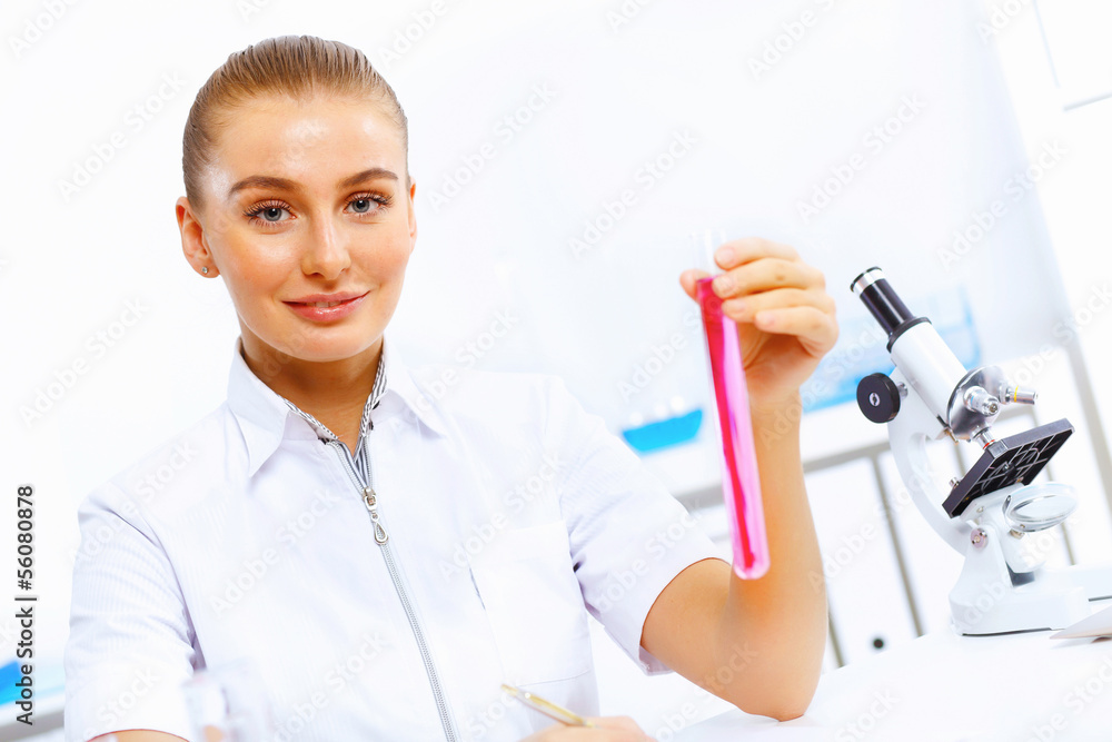 Young female scientist working in laboratory Young female scientist working in laboratory