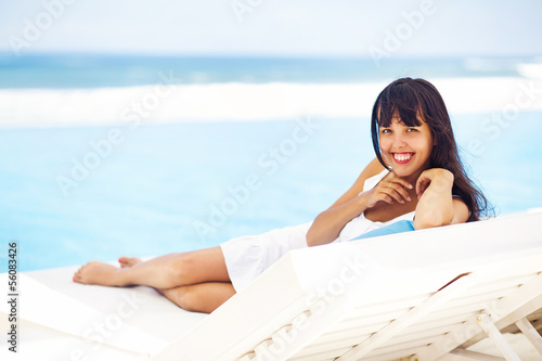 woman relaxing in resort on a sunbed 