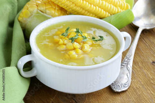 soup of fresh yellow corn served on a wooden table