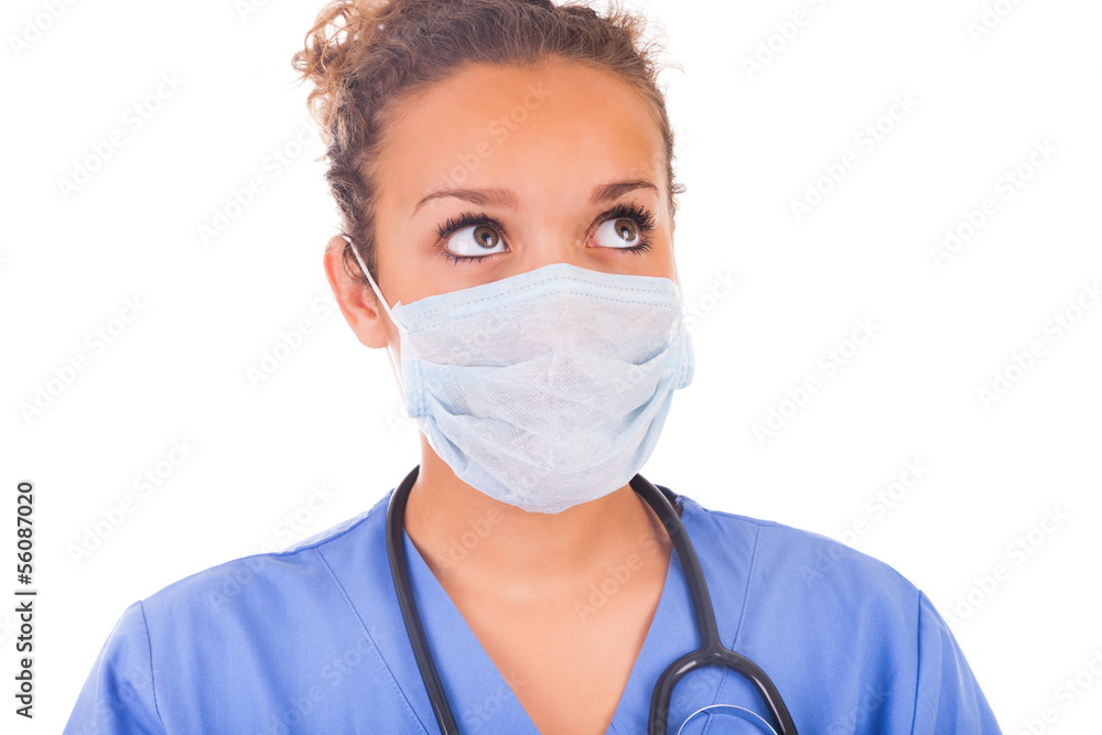 Young doctor with mask and stethoscope isolated on white backgro Young doctor with mask and stethoscope isolated on white backgro