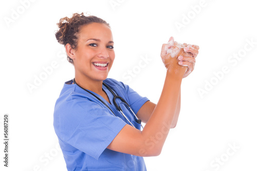 young nurse washing hands with soap