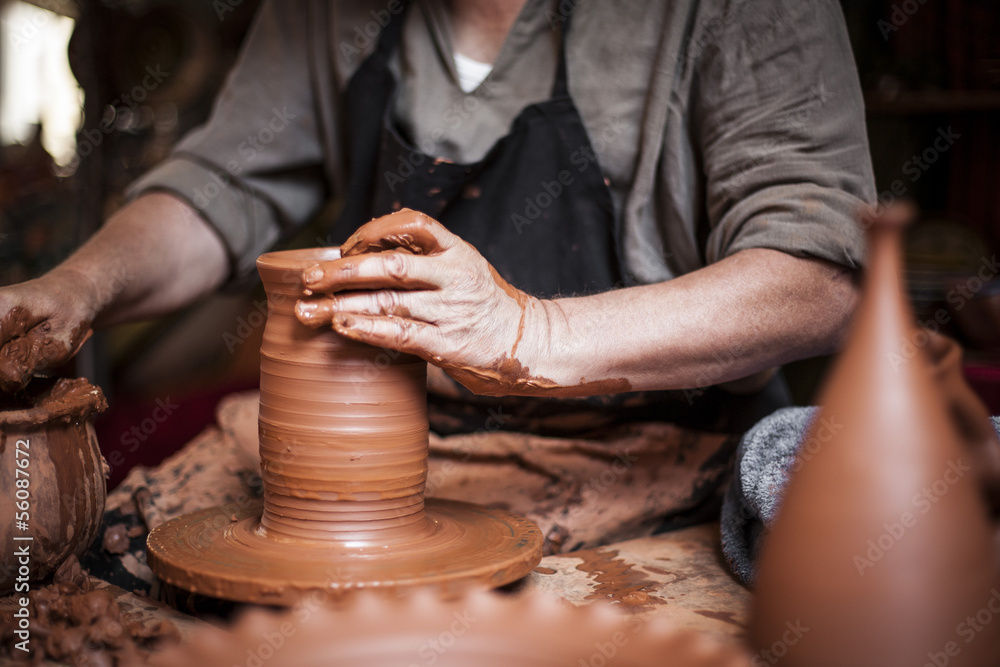 Potter working a piece of clay Potter working a piece of clay