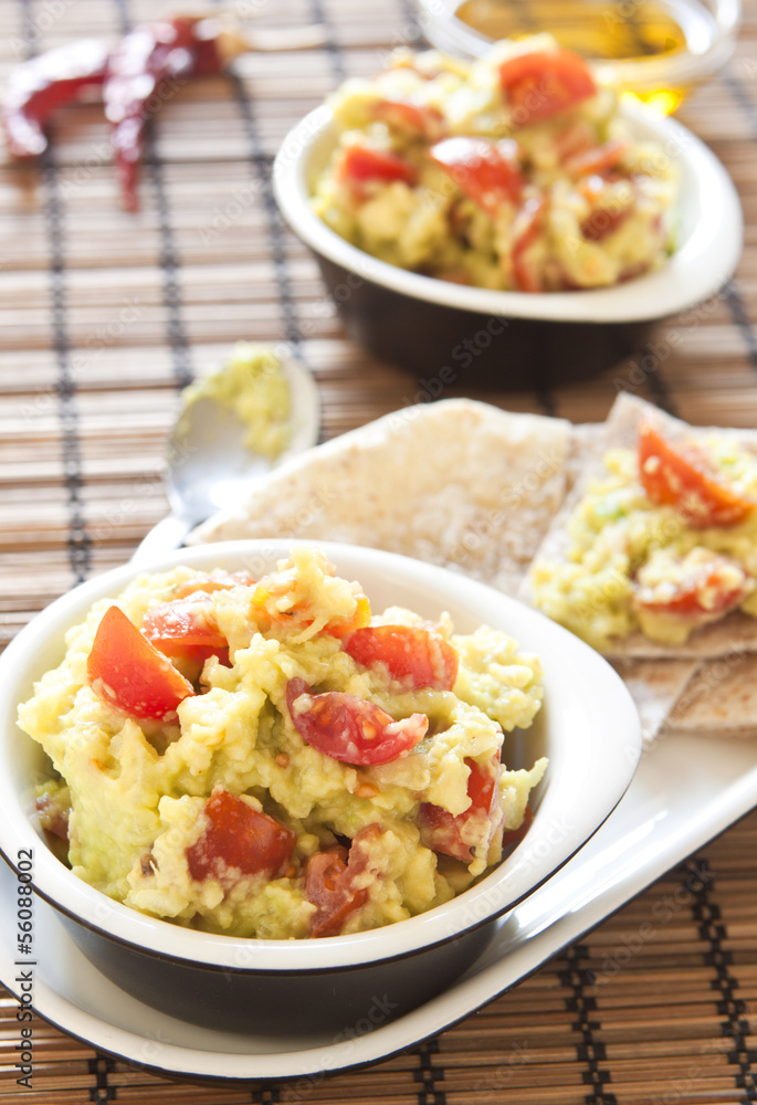 Fresh guacamole with tomatoes Fresh guacamole with tomatoes