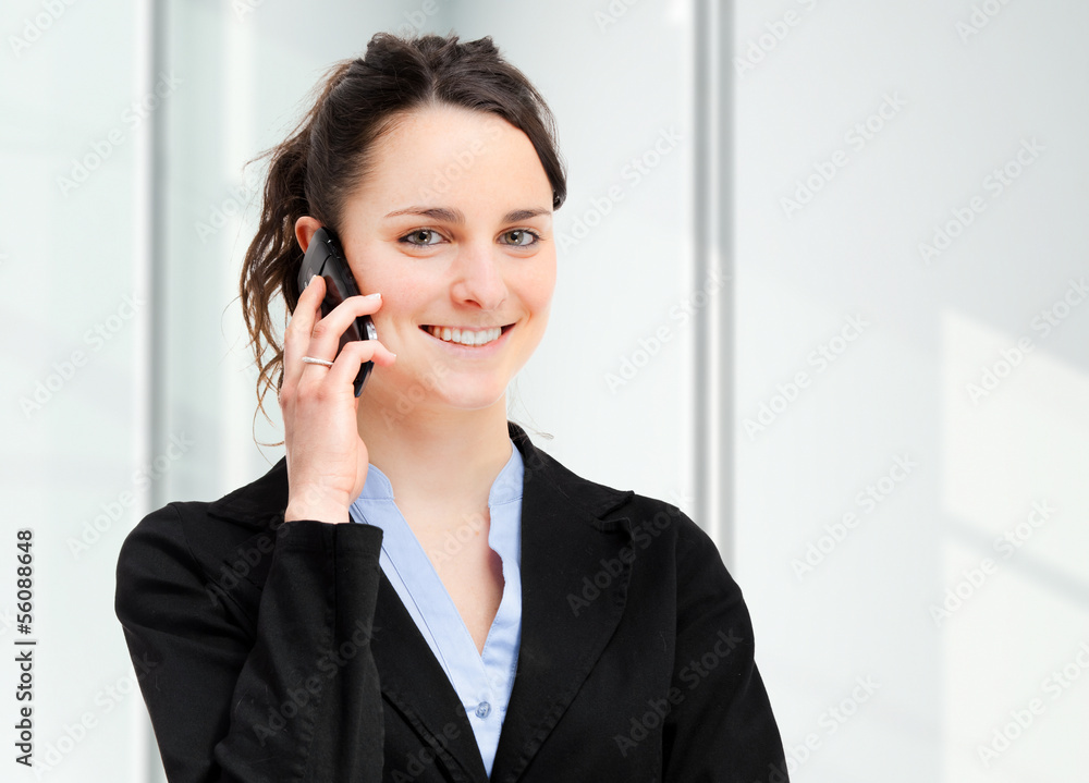 Smiling businesswoman at the phone Smiling businesswoman at the phone