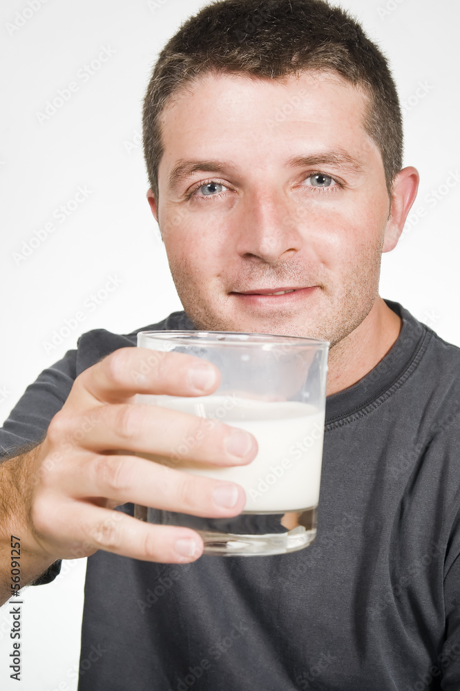 Healthy Young Man drinking a Glass of Milk Healthy Young Man drinking a Glass of Milk