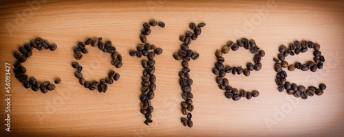 Inscription of coffee from coffee beans. Vignetting.