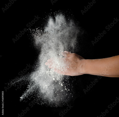 Freeze motion of dust explosion in hands © Vladyslav Bashutskyy