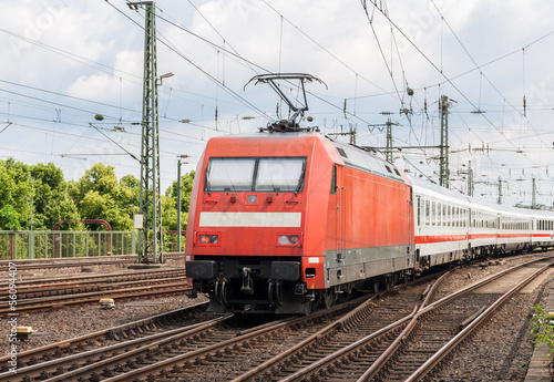 Electric locomotive with passenger train in Cologne, Germany