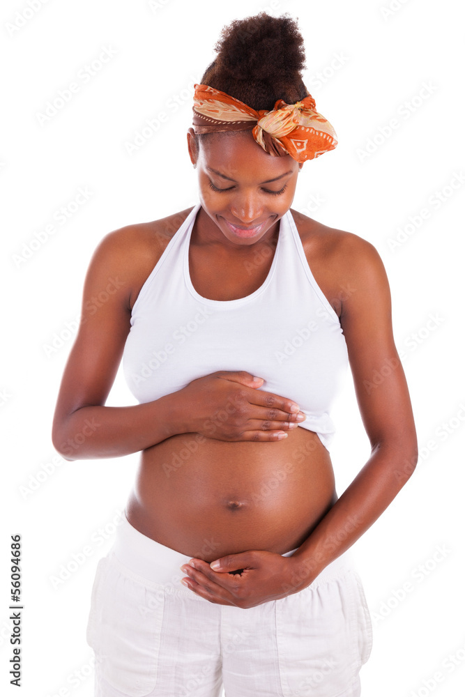 Young pregnant black woman touching her belly - African people Stock Photo