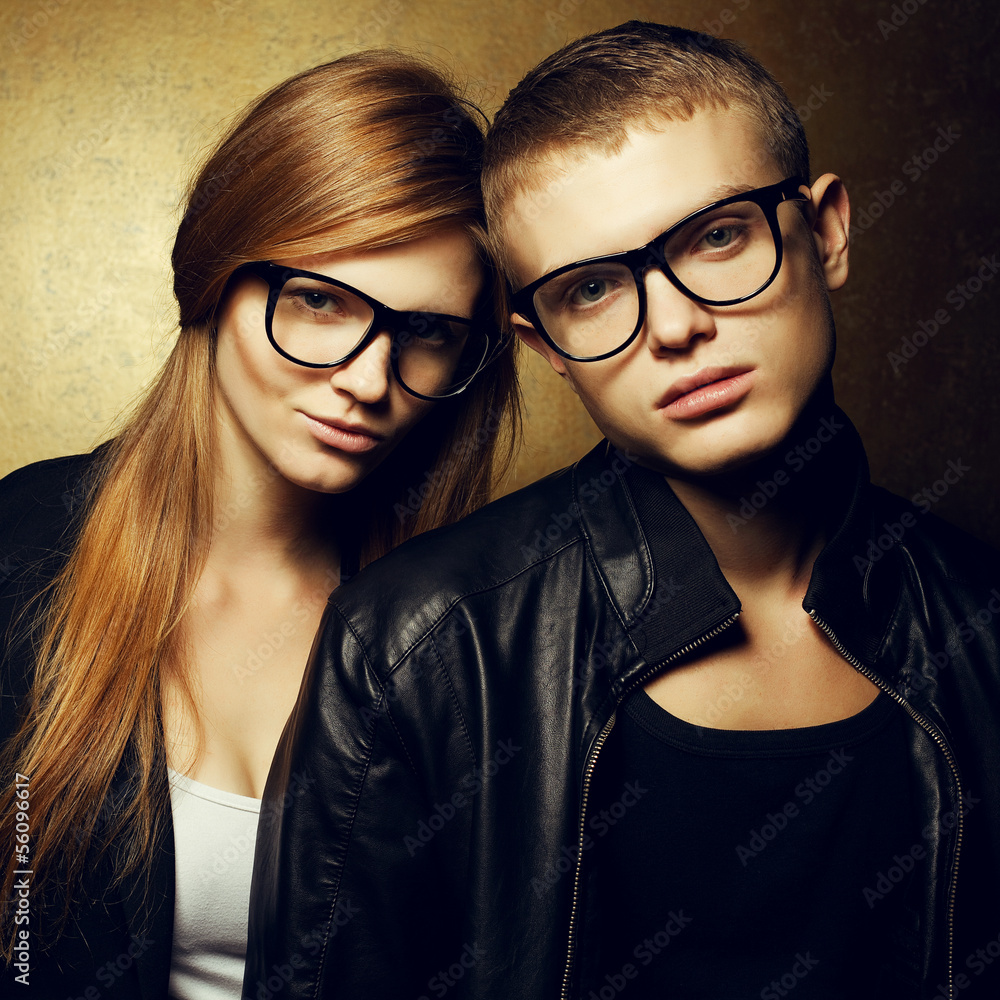 Portrait of gorgeous red-haired fashion twins in trendy glasses Portrait of gorgeous red-haired fashion twins in trendy glasses