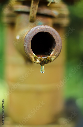 Artesian pump water droplets Old.
