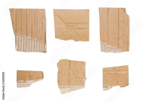 collection of ripped brown pieces of cardboard isolated on whit