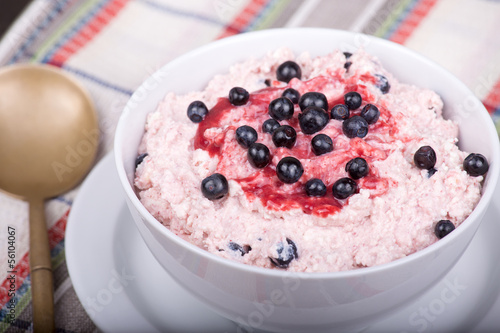 Cottage cheese with strawberry jam and blueberries