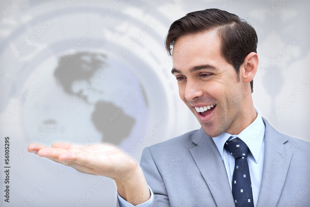 Amazed businessman looking at his hand Amazed businessman looking at his hand
