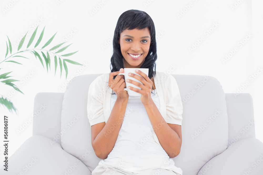Stylish black haired woman in white clothes enjoying coffee Stylish black haired woman in white clothes enjoying coffee