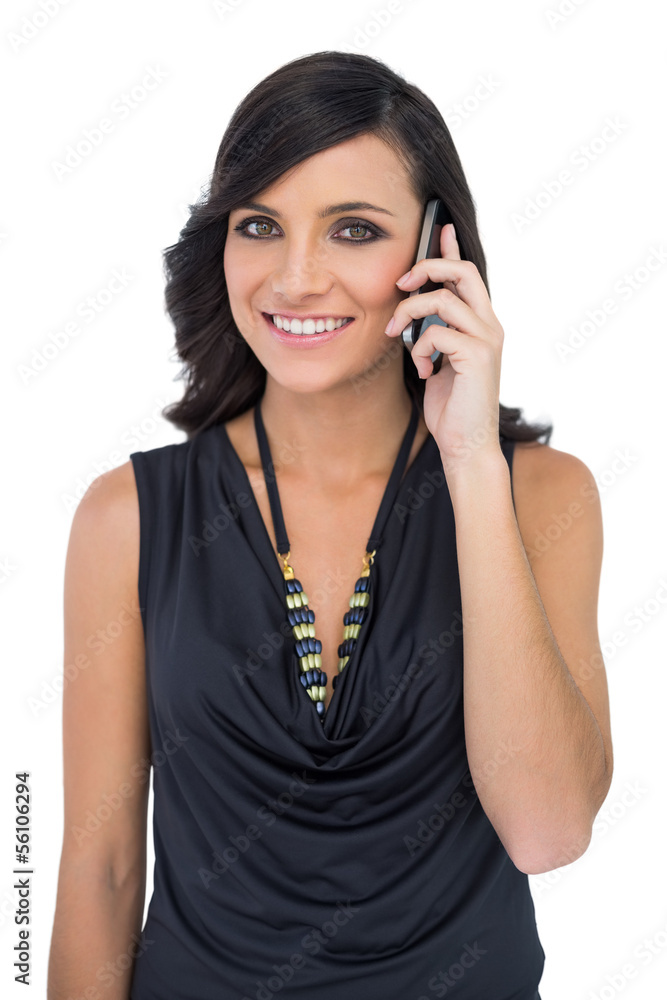 Elegant brown haired model talking on the phone Elegant brown haired model talking on the phone