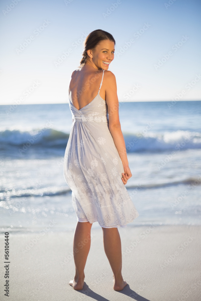 Attractive woman looking over shoulder at camera Attractive woman looking over shoulder at camera