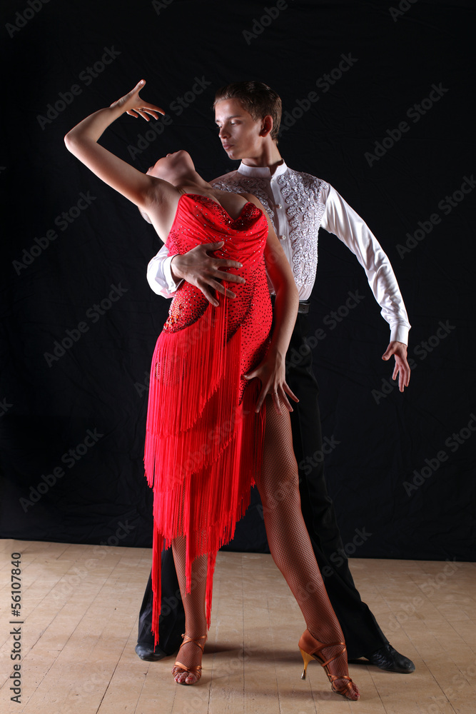 dancers in ballroom against black background dancers in ballroom against black background