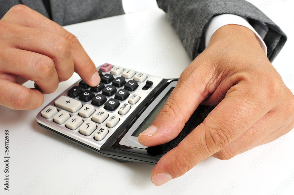businessman using a calculator businessman using a calculator