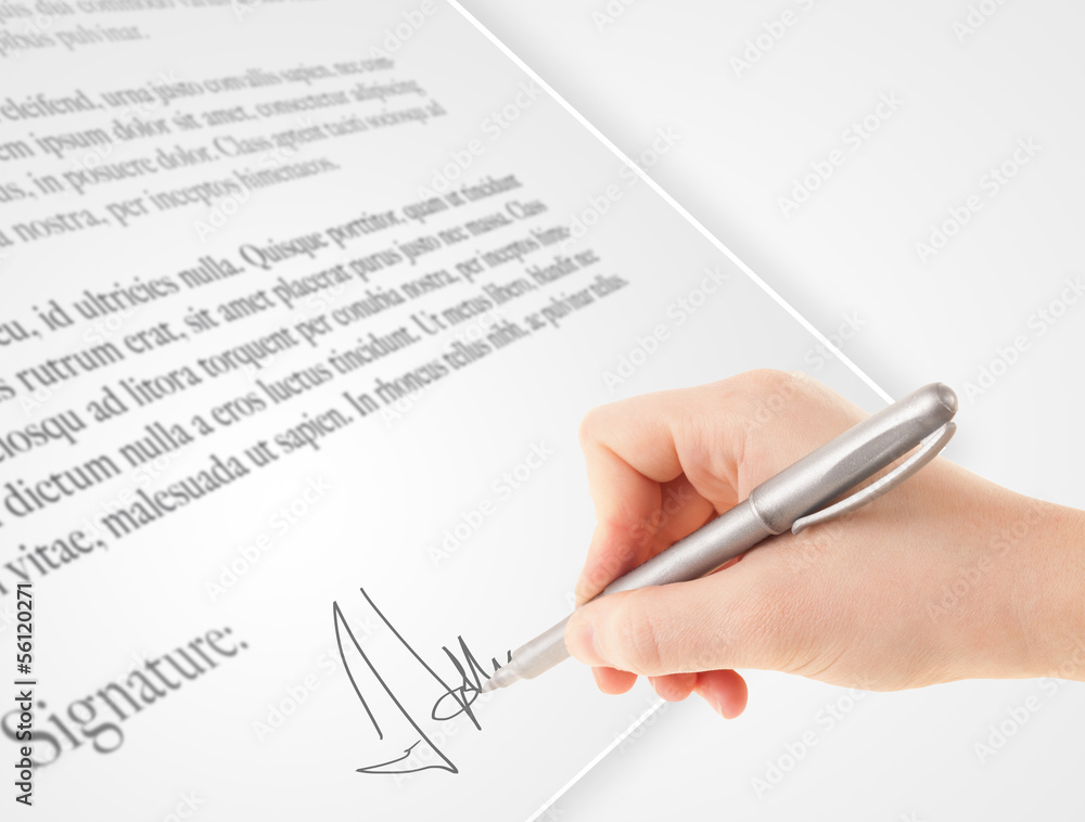 Hand writing personal signature on a paper form Hand writing personal signature on a paper form