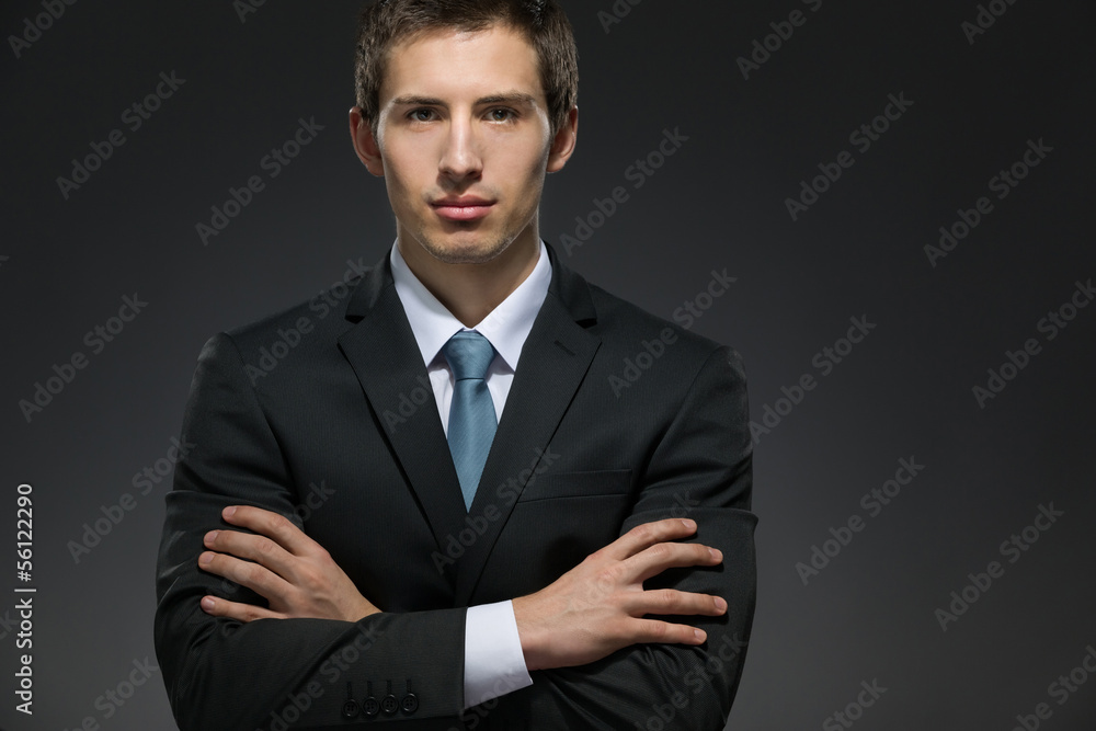 Half-length portrait of businessman with his arms crossed Half-length portrait of businessman with his arms crossed