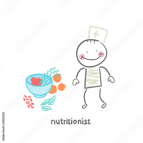 nutritionist standing next to a bowl of vegetables