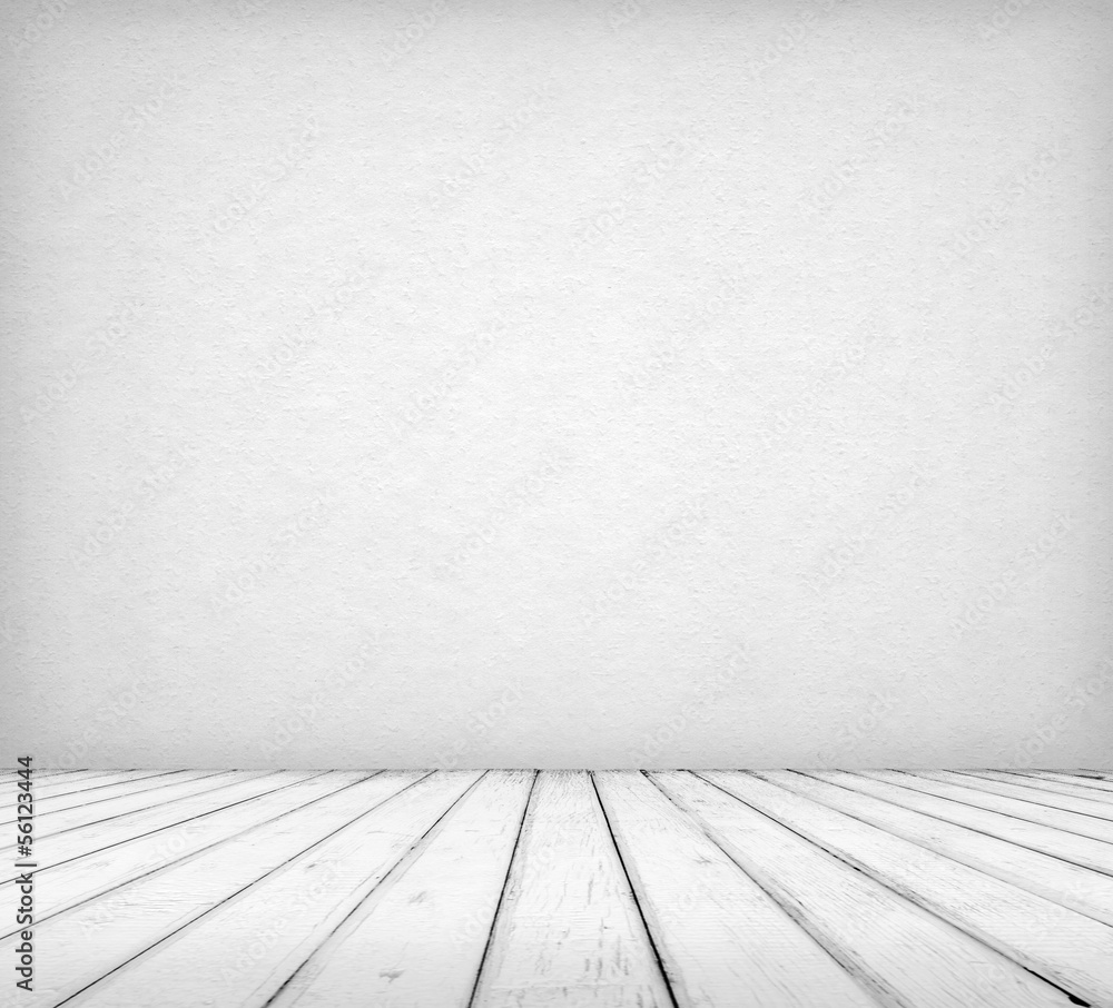 Fototapeta premium This empty room interior features a textured grey wall and a light wood plank floor, creating a neutral background space.