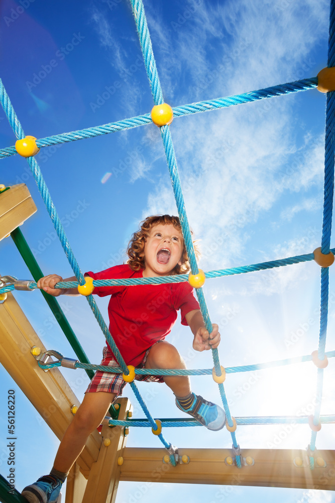 Scream fun expression of boy on playground Scream fun expression of boy on playground
