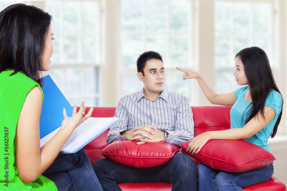 Young couple consults talking to psychologist Young couple consults talking to psychologist