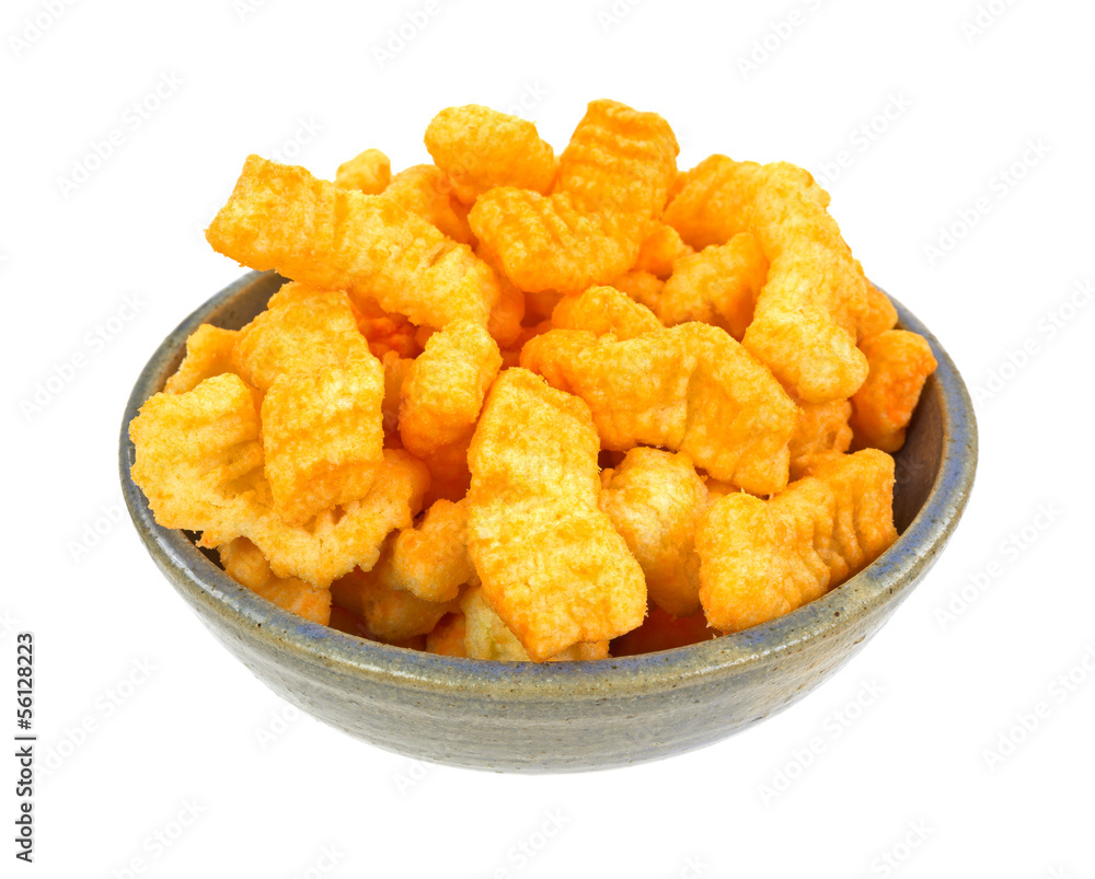 Crunchy cheddar cheese snacks in an old bowl Crunchy cheddar cheese snacks in an old bowl