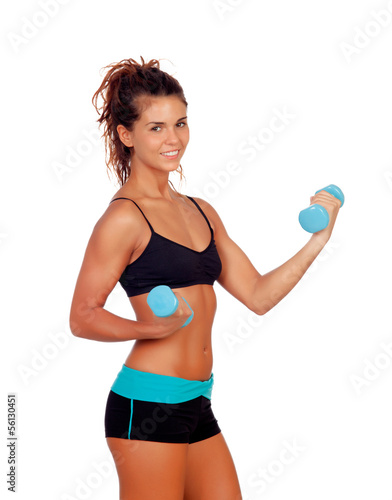 Beautiful woman doing weights to tone her muscles
