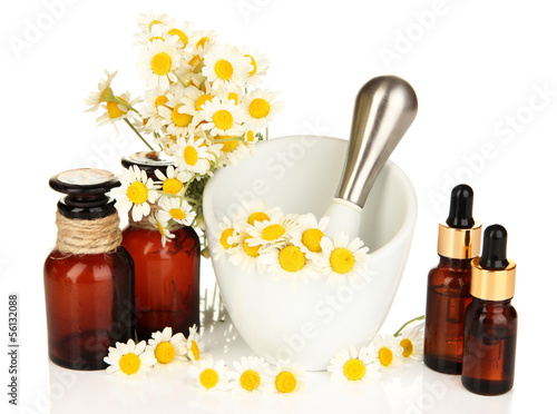 Fototapeta Naklejka Na Ścianę i Meble -  Essential oil and chamomile flowers in mortar isolated on white