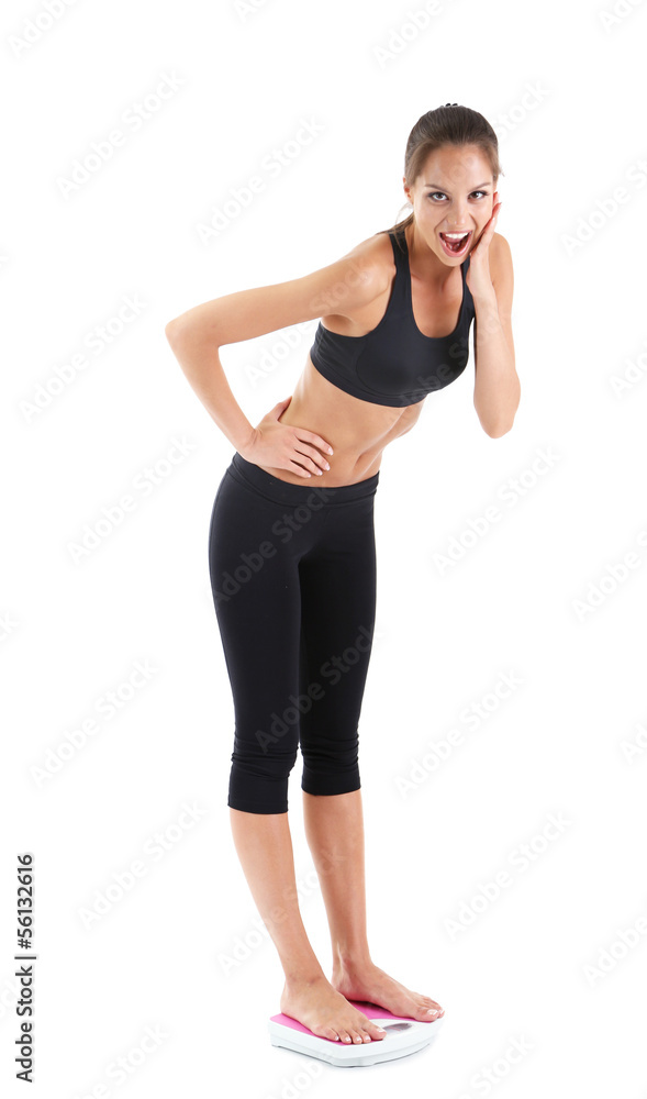 Slim young girl on scales isolated on white Slim young girl on scales isolated on white