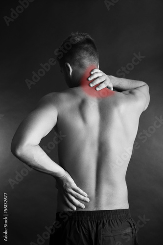 Young man with back pain on...
