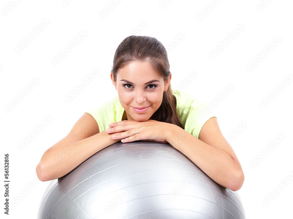 Young beautiful fitness girl with grey ball isolated on white
