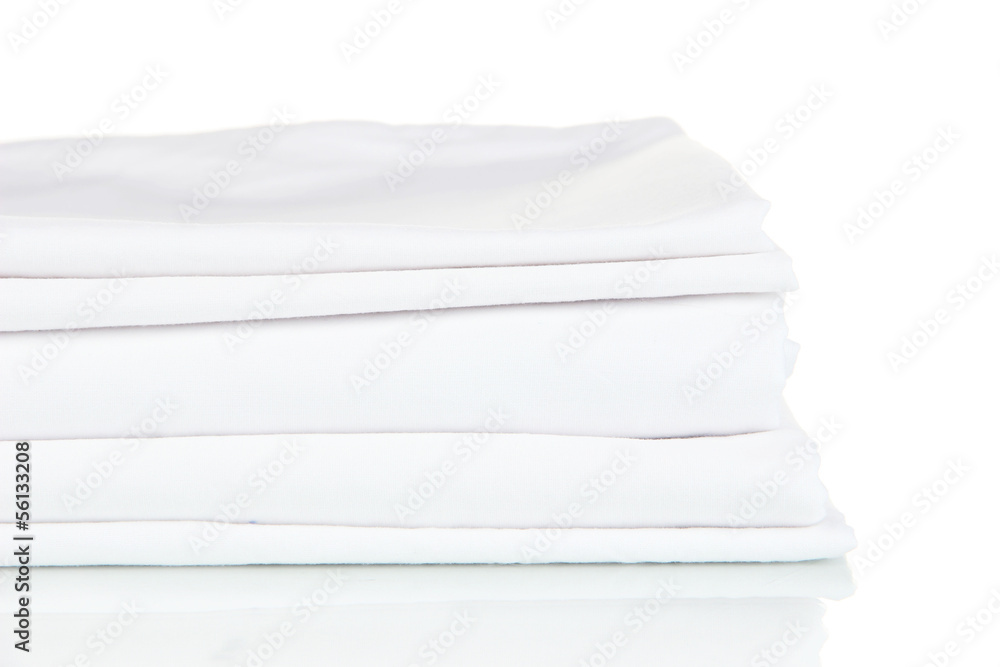 Stack of clean bedding sheets isolated on white Stack of clean bedding sheets isolated on white
