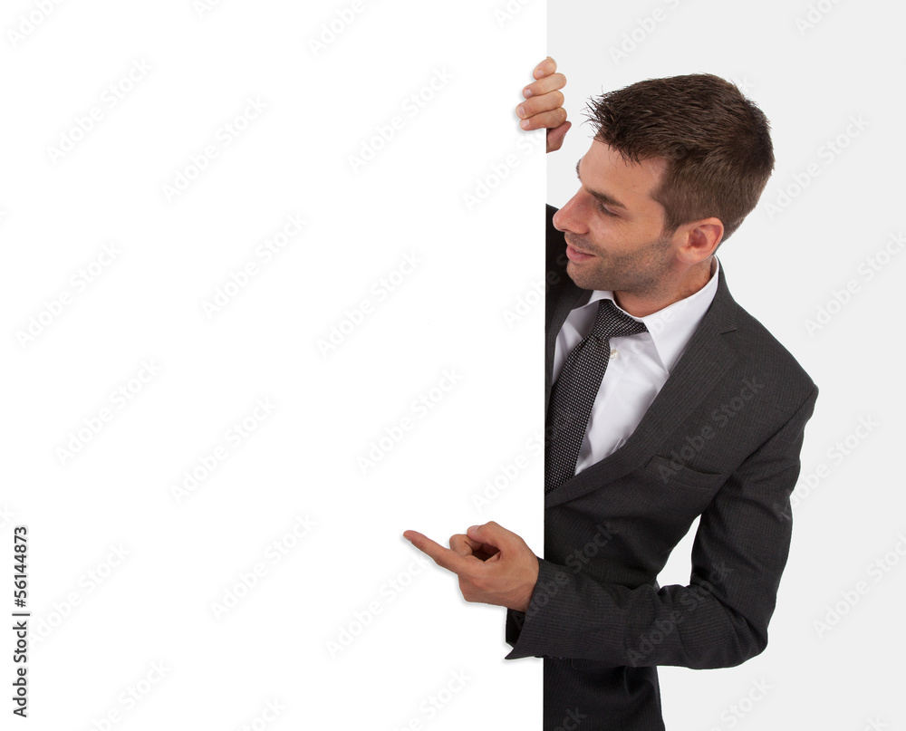 Businessman pointing at a blank board Businessman pointing at a blank board