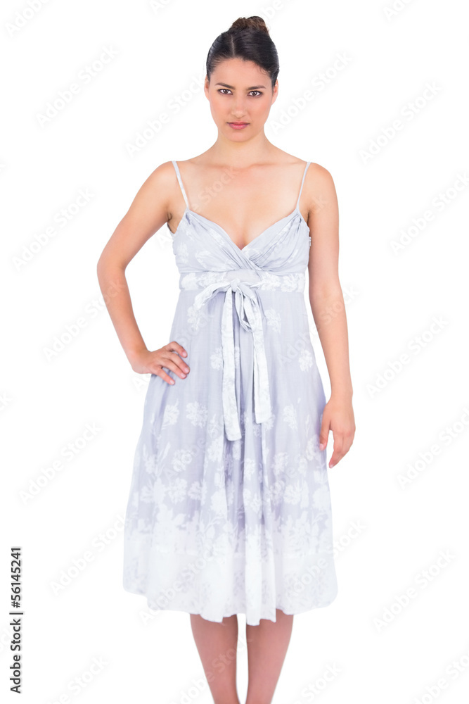 Serious seductive young model in summer dress posing Serious seductive young model in summer dress posing