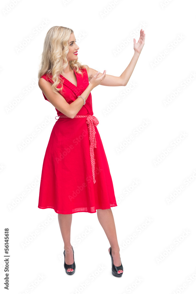 Glamorous blonde woman presenting something Glamorous blonde woman presenting something