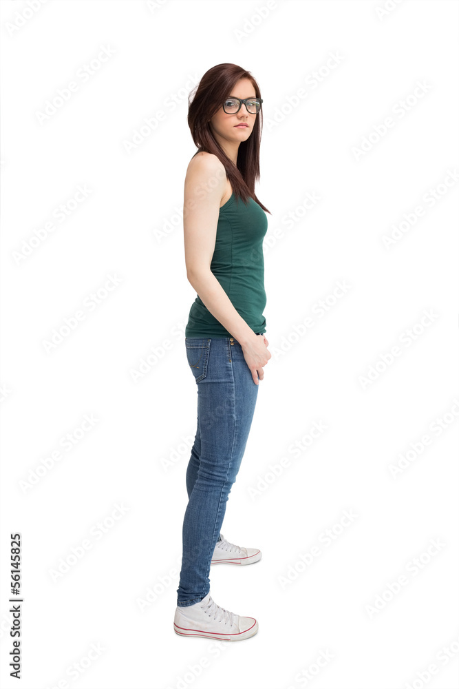 Unsmiling young woman with glasses posing Unsmiling young woman with glasses posing