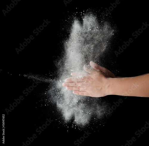 Freeze motion of dust explosion in hands © Vladyslav Bashutskyy