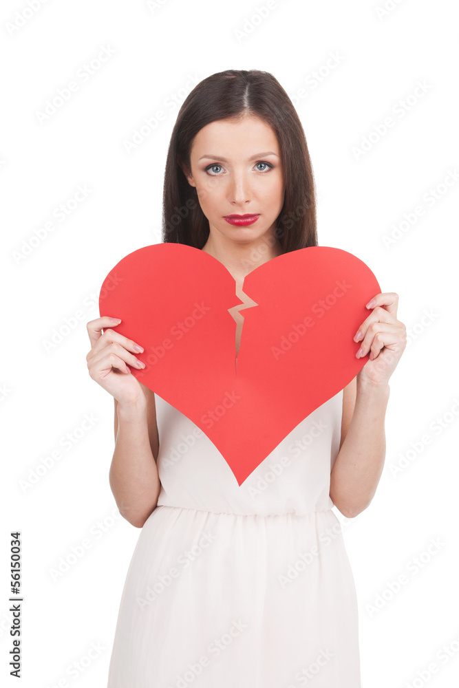 Broken heart. Beautiful young woman holding broken paper heart a Broken heart. Beautiful young woman holding broken paper heart a