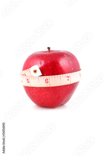 Fresh apple with measuring tape