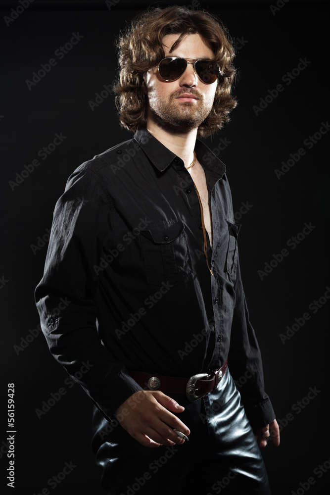Cool rock style dancing musician with long brown hair and beard. Cool rock style dancing musician with long brown hair and beard.