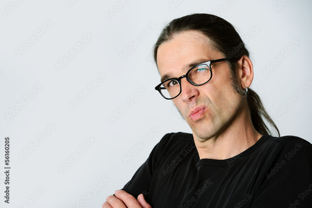 man is looking skeptical man is looking skeptical