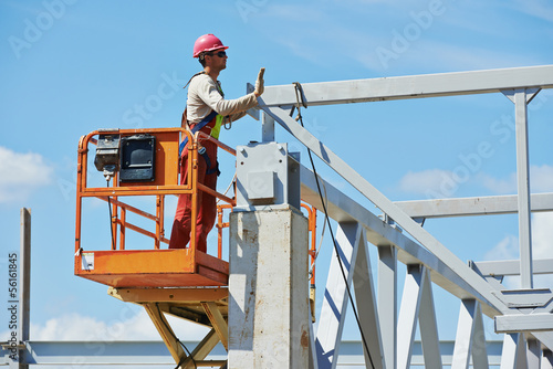 builder millwright worker at construction site photo