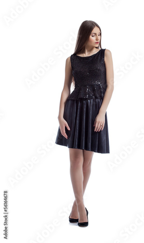 Image of thoughtful brunette posing in smart dress