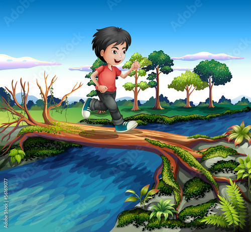 A boy running while crossing the river
